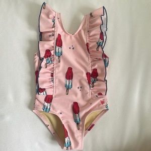 pink chicken baby swimsuit. Rocket pop!